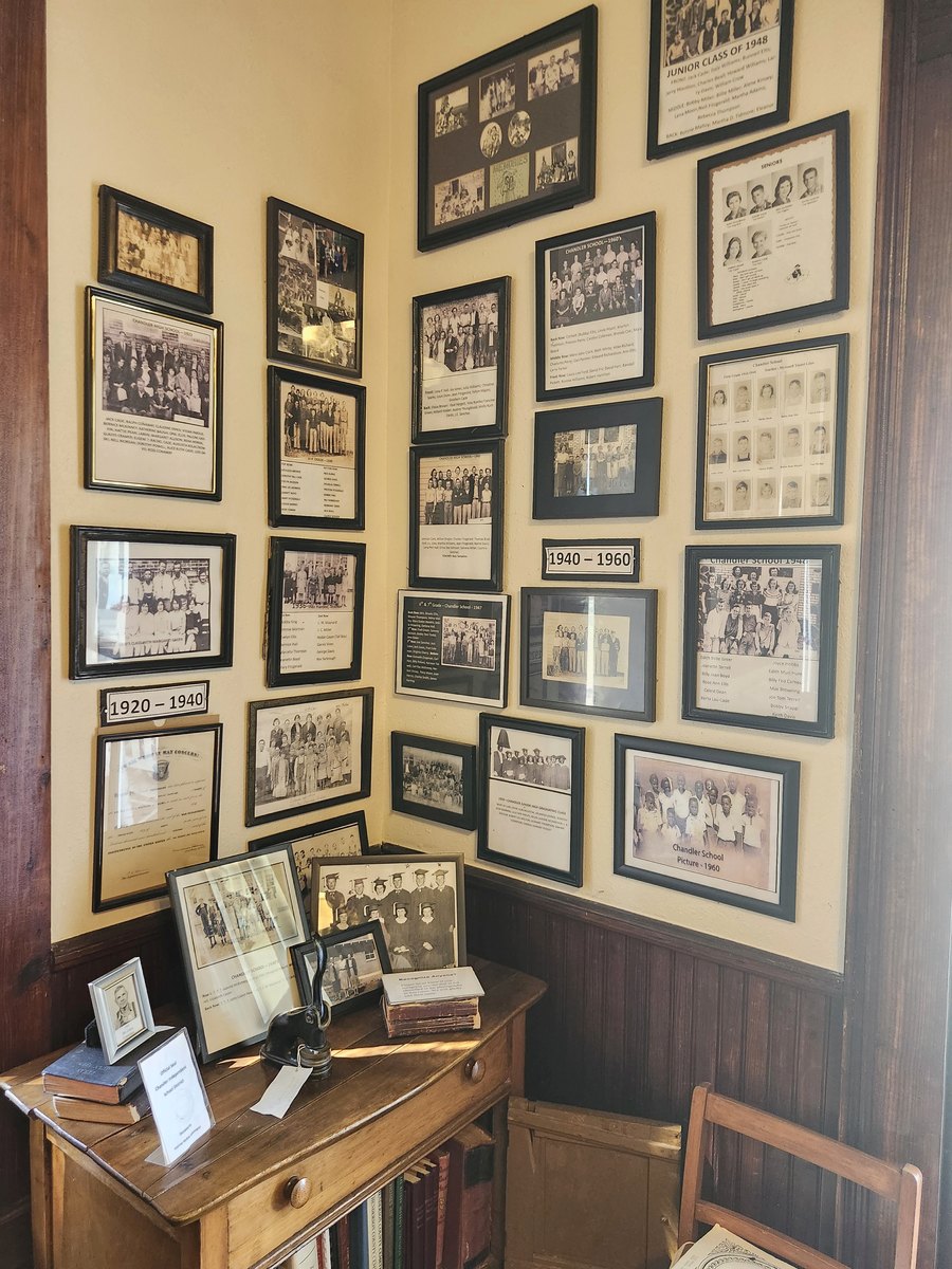 Framed Chandler school class photos hanging on a museum wall