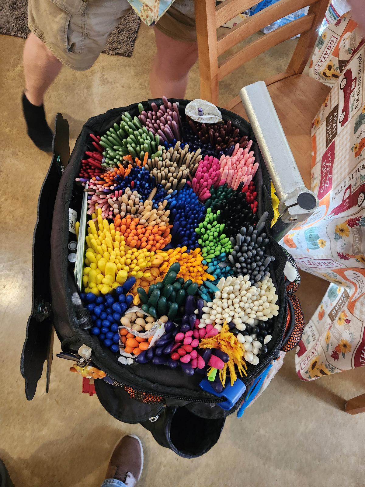 Kornpop’s open balloon bag, packed with balloons sorted by color